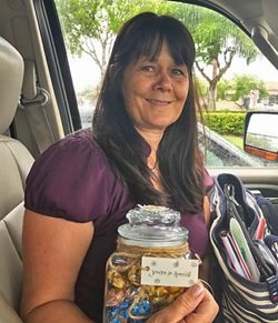 Debbie holding treats before visit with doctor's office