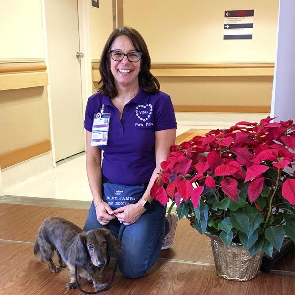 A VITAS Paw Pals volunteer dog and its human companion