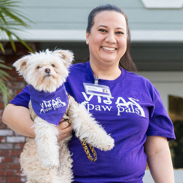 A VITAS Paw Pals volunteer dog and its human companion